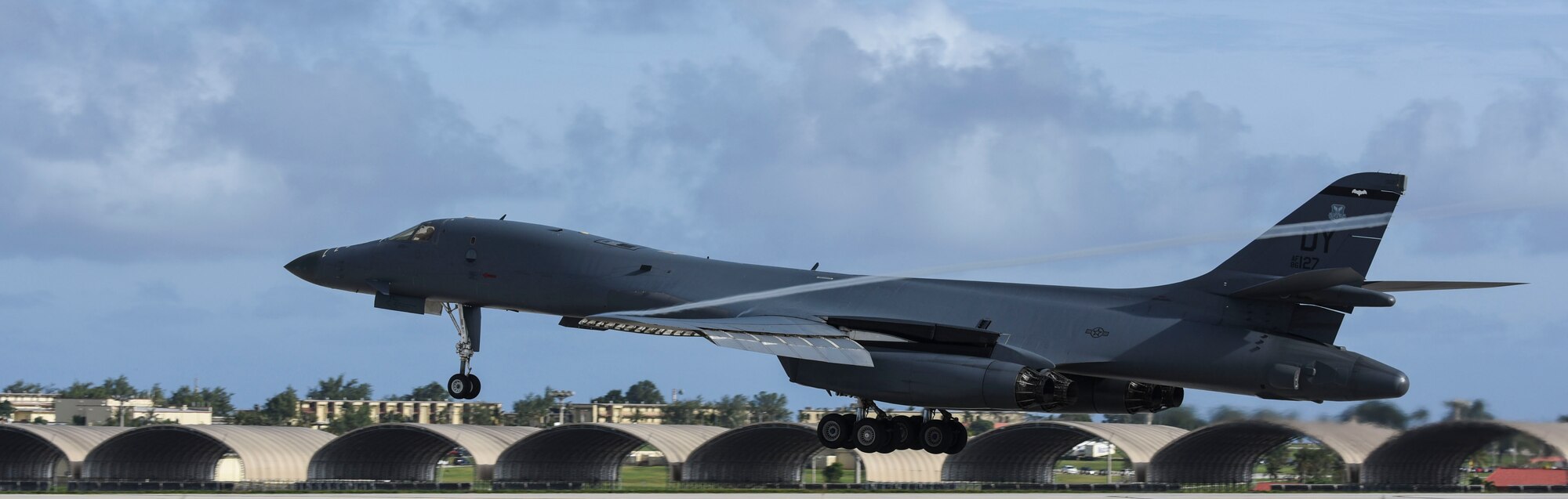 A U.S. Air Force B-1B Lancer assigned to the 9th Expeditionary Bomb Squadron, deployed from Dyess Air Force Base, Texas, lands Feb. 6, 2017, at Andersen AFB, Guam. The 9th EBS is taking over U.S. Pacific Command’s Continuous Bomber Presence operations from the 34th EBS, assigned to Ellsworth Air Force Base, S.D. The B-1B's blended wing/body configuration, variable-geometry wings and turbofan afterburning engines, combine to provide long range, maneuverability and high speed while enhancing survivability. The rotation of aircraft in support is specifically designed to demonstrate the U.S.’s commitment to the Indo-Asia-Pacific region and enhance routine transiting in international airspace throughout the Pacific. (U.S. Air Force photo by Tech. Sgt. Richard P. Ebensberger/Released)