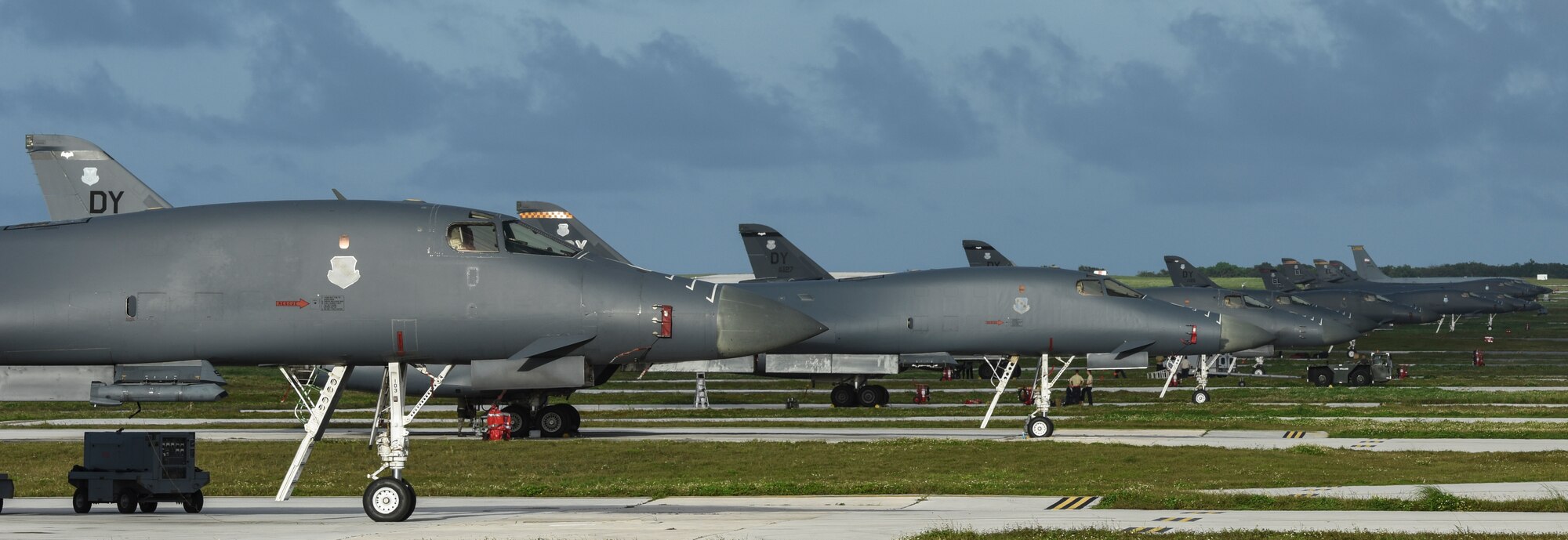 Twelve U.S. Air Force B-1B Lancers assigned to the 9th Expeditionary Bomb Squadron, deployed from Dyess Air Force Base, Texas, and the 34th EBS, assigned to Ellsworth Air Force Base, S.D., sit beside one another on the flightline Feb. 6, 2017, at Andersen AFB, Guam. The B-1s are highly versatile, multi-mission weapon systems capable of tracking, targeting and engaging moving vehicles as well as allowing aircrew to receive targeting data from the Combined Air Operations Center or other command and control assets to strike emerging targets rapidly and efficiently. The U.S. military has maintained a deployed strategic bomber presence in the Pacific since March 2004, which has contributed significantly to regional security and stability. (U.S. Air Force photo by Tech. Sgt. Richard P. Ebensberger/Released)