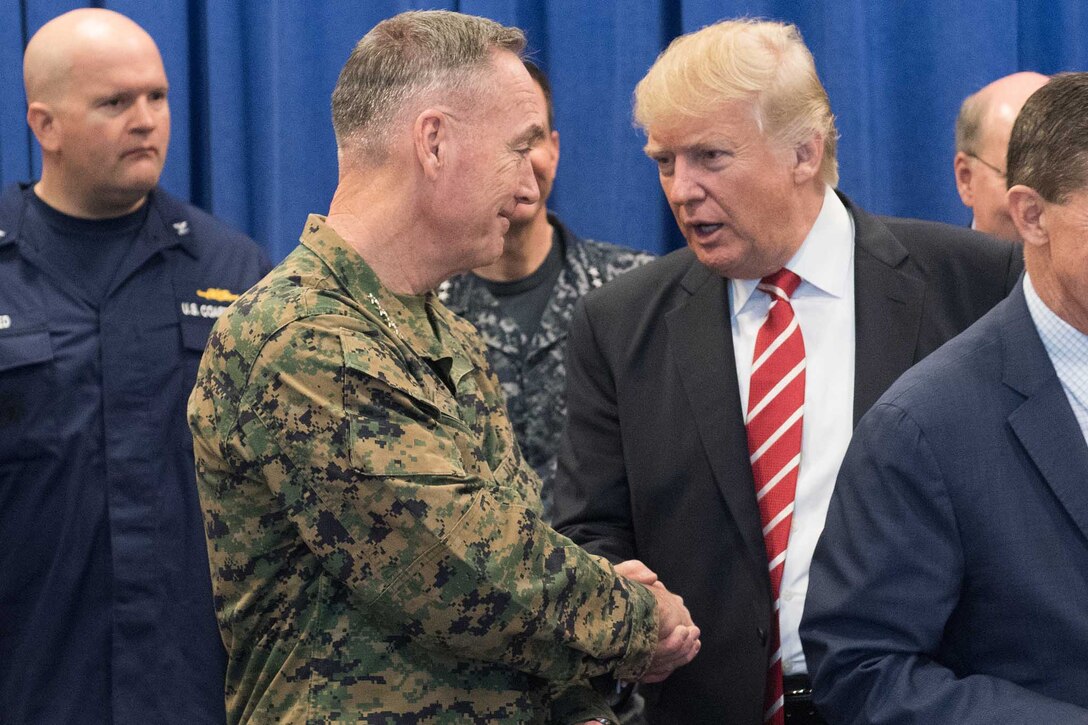 President Donald J. Trump and Marine Corps Gen. Joe Dunford, chairman of the Joint Chiefs of Staff, talk before a meeting with leaders from both U.S. Special Operations Command and U.S. Central Command at MacDill Air Force Base, Fla., Feb. 6, 2017. DoD photo by D. Myles Cullen
