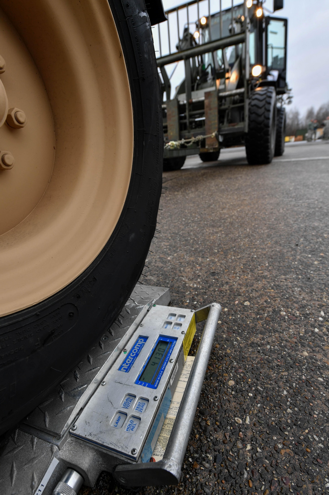A scale displays the weight of part of a hard-sided expandable light air mobile shelter during Exercise Austere Forge on Ramstein Air Base, Germany, Jan. 30, 2017. The HELAMS is a mobile workspace for air-to-air and air-to-ground operations. The 435th Contingency Response Group participated in the exercise to practice standing up a base in a forward location within 72 hours. (U.S. Air Force photo by Senior Airman Tryphena Mayhugh)