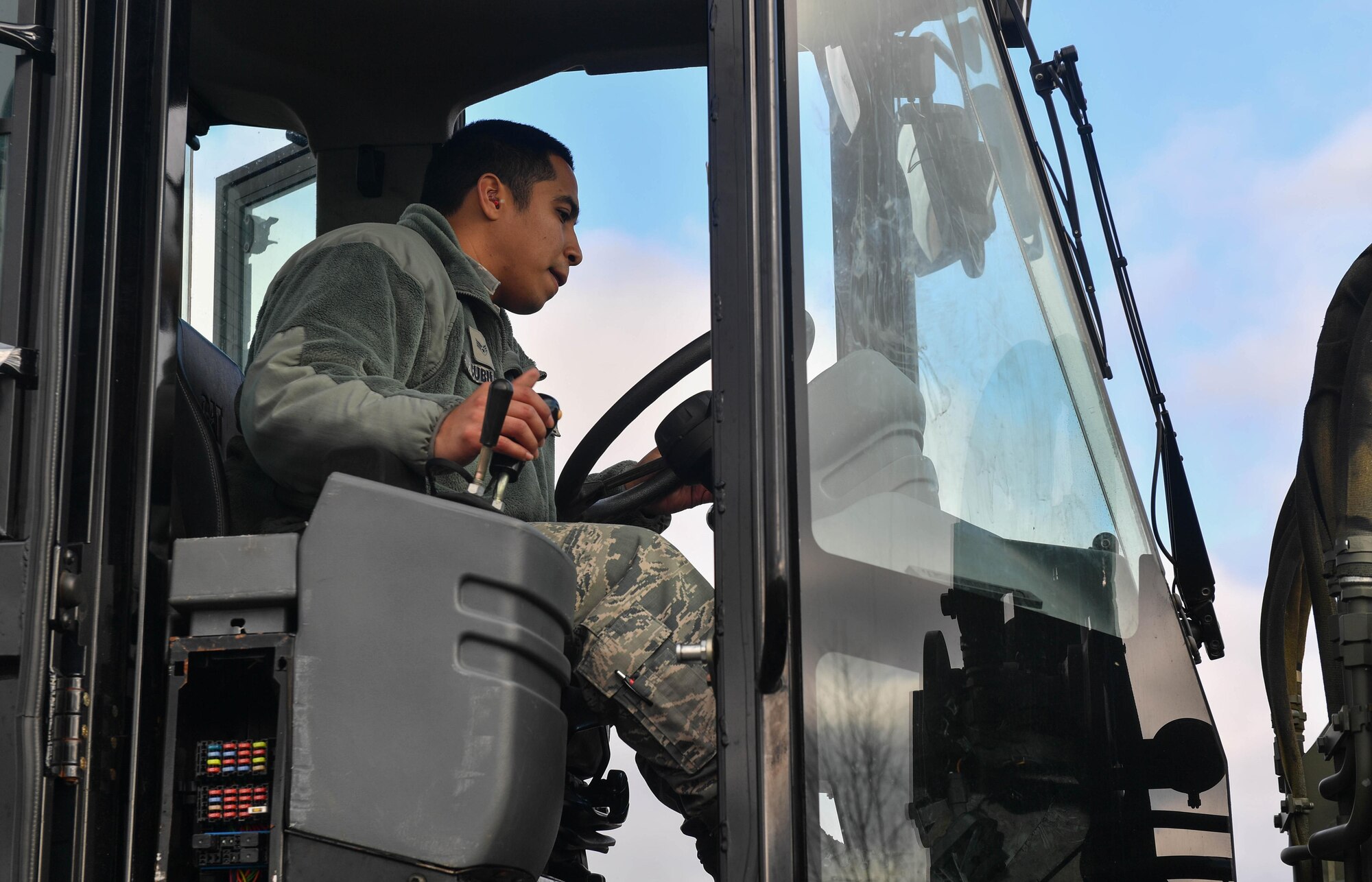 Senior Airman Tomas Cubilla, 435th Contingency Response Squadron aerial porter technician, operates a 10K alternating forklift during Exercise Austere Forge on Ramstein Air Base, Germany, Jan. 31, 2017. All the equipment used on the exercise had to be weighed and properly secured to pallets for transportation in an aircraft. The 435th Contingency Response Group participated in the exercise to practice their capability to deploy within 72 hours. (U.S. Air Force photo by Senior Airman Tryphena Mayhugh)