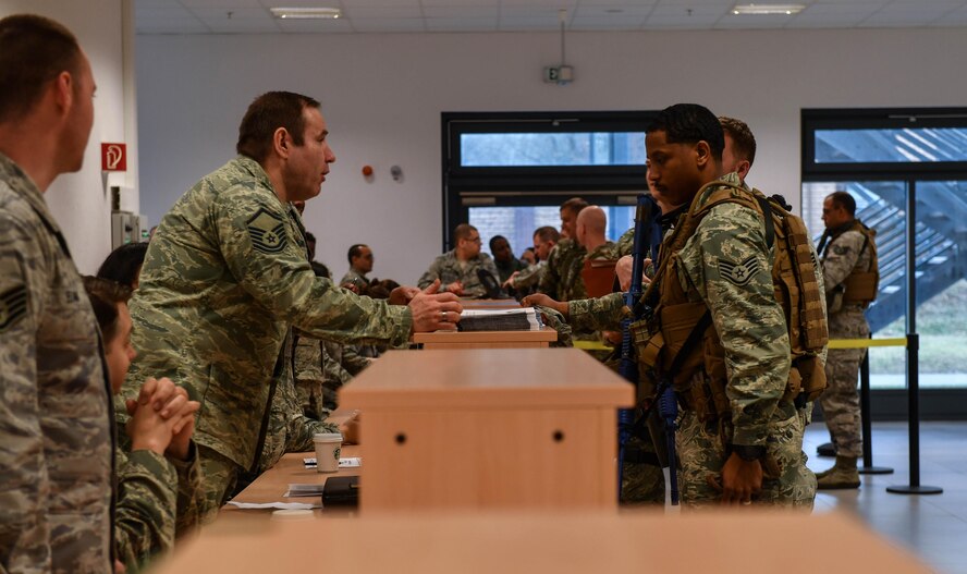 Airmen assigned to the 435th Contingency Response Group process through the installation deployment readiness cell during Exercise Austere Forge at Ramstein Air Base, Germany, Feb. 1, 2017. The Airmen received a pre-deployment brief, processed through various organizations, and received gear relevant to their location. The 435 CRG participated in the exercise to practice their capability to deploy within 72 hours. (U.S. Air Force photo by Senior Airman Tryphena Mayhugh)