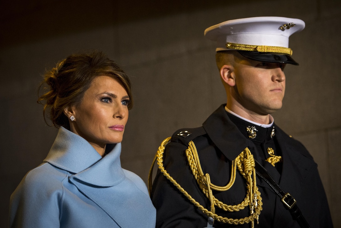 Melania Trump, escorted by a U.S. Marine, walks toward the platform the 58th Presidential Inauguration in Washington, D.C., Jan. 20, 2017. More than 5,000 military members from across all branches of the armed forces of the United States, including reserve and National Guard components, provided ceremonial support and Defense Support of Civil Authorities during the inaugural period. (DoD photo by U.S. Air Force Staff Sgt. Marianique Santos)