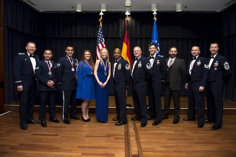 Annual award winners from the 52nd Fighter Wing pose for a group photo with wing leadership during the 2016 Annual Award banquet at Spandahlem Air Base, Germany on Feb. 3, 2016. The banquet began with a ceremony to highlight all nominees and ended with the recognition of 13 winners. (U.S. Air Force photo by Airman 1st Class Preston Cherry)