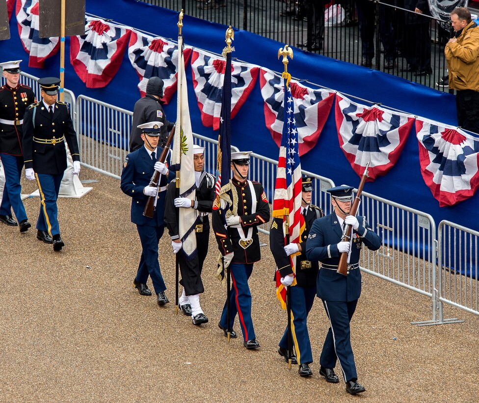 The joint color guard, comprised of service members from all five branches of the U.S. Armed Forces, march toward the White House reviewing stand in Washington D.C., Jan. 20, 2017. More than 5,000 military members from across all branches of the armed forces of the United States, including Reserve and National Guard components, provided ceremonial support and Defense Support of Civil Authorities during the inaugural period. (DoD photo by U.S. Air Force Tech. Sgt. Trevor Tiernan)