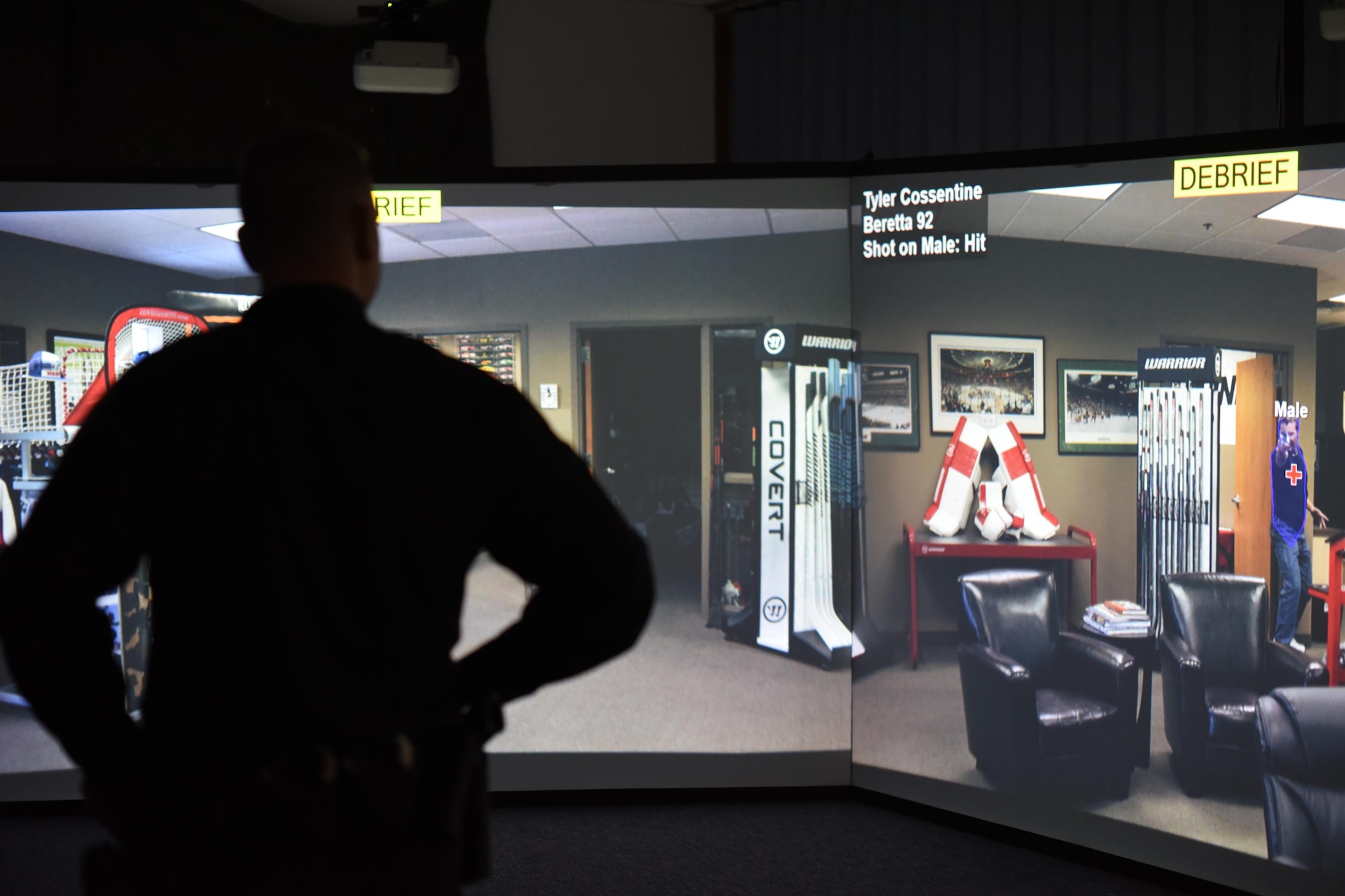 Officer Ryan Lee, 22nd Security Forces Squadron patrolman, reviews his performance with the Milo Range Training System, Feb. 1, 2017, at McConnell Air Force Base, Kan. The simulator utilizes the Beretta M9, the firearm most officers carry daily, by using a laser device inside of the chamber that displays exactly where the gun was pointed when the trigger is pulled. (U.S. Air Force photo/Senior Airman Christopher Thornbury)