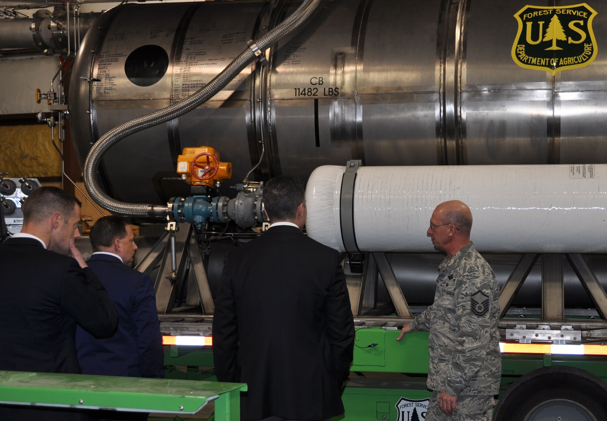PETERSON AIR FORCE BASE, Colo. – Master Sgt. Tom Freeman, right, a Modular Airborne Fire Fighting System-qualified C-130 loadmaster with the 302nd Airlift Wing talks about the U.S. Forest Service MAFF-system with staff members from U.S. Congressman Doug Lamborn’s office Jan. 20, 2017. The delegation spent the morning with the Air Force Reserve Command wing, seeing first-hand the 302nd AW’s primary and MAFFS missions. (U.S. Air Force photo/Daniel Butterfield)