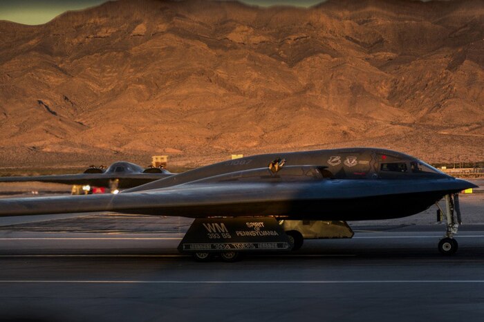 Two B-2 Spirit stealth bombers assigned to the 509th Bomb Wing taxi in preparation for takeoff during Deliberate Strike Night at Nellis Air Force Base, Nev., June 16, 2016. Two B-2s departed Whiteman Air Force Base, Mo., for a transatlantic flight to Libya on Jan. 18, 2017, in what would become the B-2’s first combat mission since Operation Odyssey Dawn in 2011. Air Force photo by Airman 1st Class Kevin Tanenbaum