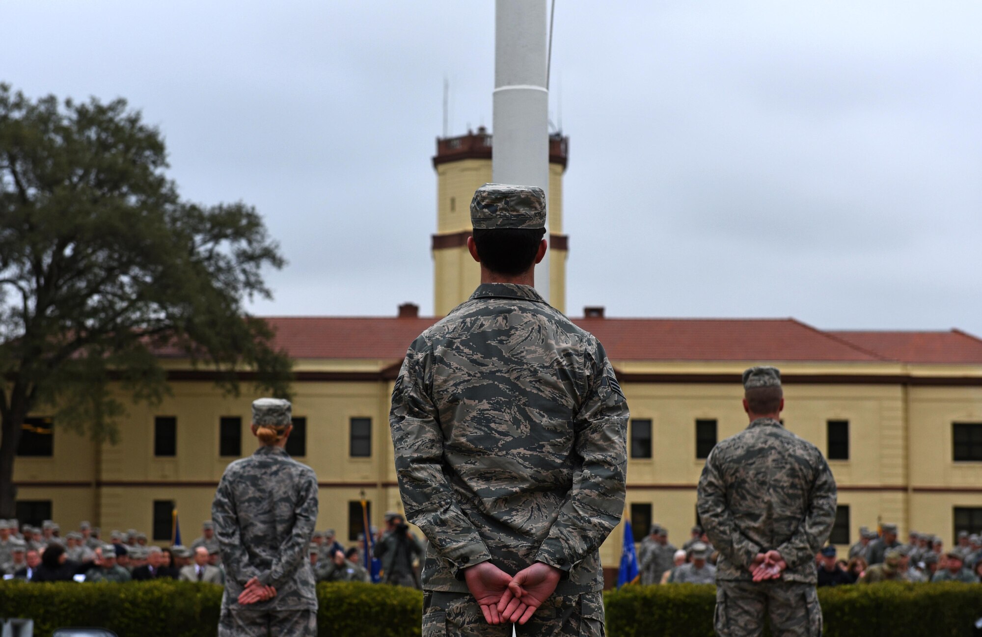 Bomber Airmen from across the country gather around the 2nd Bomb Wing flag pole for a retreat ceremony at Barksdale Air Force Base, La., Feb. 2, 2016. U.S. Air Force Maj. Gen. Thomas Bussiere, 8th Air Force commander, spoke at the retreat ceremony, which was followed by an in-trail formation of a B-1, B-2 and B-52 bomber flyover. The flyover took place as part of the 8th Air Force’s 75th anniversary events. (U.S. Air Force photo by Senior Airman Erin Trower)