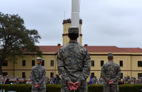 Bomber Airmen from across the country gather around the 2nd Bomb Wing flag pole for a retreat ceremony at Barksdale Air Force Base, La., Feb. 2, 2016. U.S. Air Force Maj. Gen. Thomas Bussiere, 8th Air Force commander, spoke at the retreat ceremony, which was followed by an in-trail formation of a B-1, B-2 and B-52 bomber flyover. The flyover took place as part of the 8th Air Force’s 75th anniversary events. (U.S. Air Force photo by Senior Airman Erin Trower)