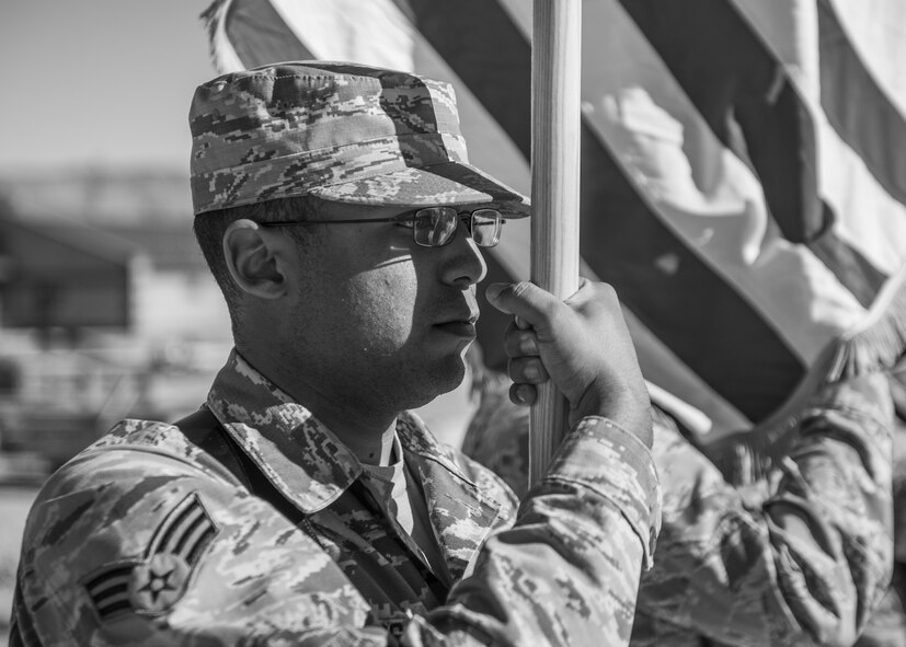 Senior Airman Steven Shivers, a Steel Talons Honor Guard member, holds the American flag while practicing the colors ceremony at Heritage Park at Holloman Air Force Base, N.M., on Feb. 1, 2017. The Steel Talons Honor Guard was created to honor fallen members of the armed services, both past and present. The honor guard performs at a variety of events, including change of command ceremonies, where they carry out the posting of the colors. (U.S. Air Force photo by Airman 1st Class Alexis P. Docherty)