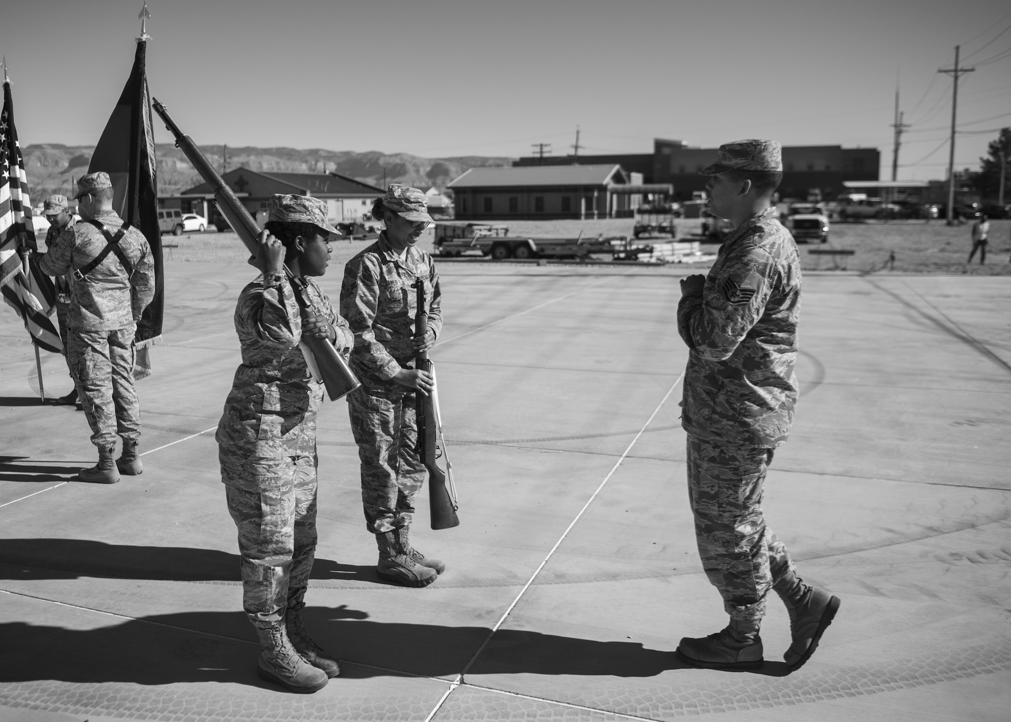 Staff Sgt. Maurice Coleman, the Steel Talons Honor Guard operations technician, instructs Airman 1st Class Jhadira James and Airman 1st Class Victoria DeLoach, Steel Talons Honor Guard members, on correct rifle handling for the colors ceremony during a practice session at Heritage Park at Holloman Air Force Base, N.M., on Feb. 1, 2017. The Steel Talons Honor Guard was created to honor fallen members of the armed services, both past and present. The honor guard practices its duties daily, from flag dressing and folding to firing of a rifle. (U.S. Air Force photo by Airman 1st Class Alexis P. Docherty) 