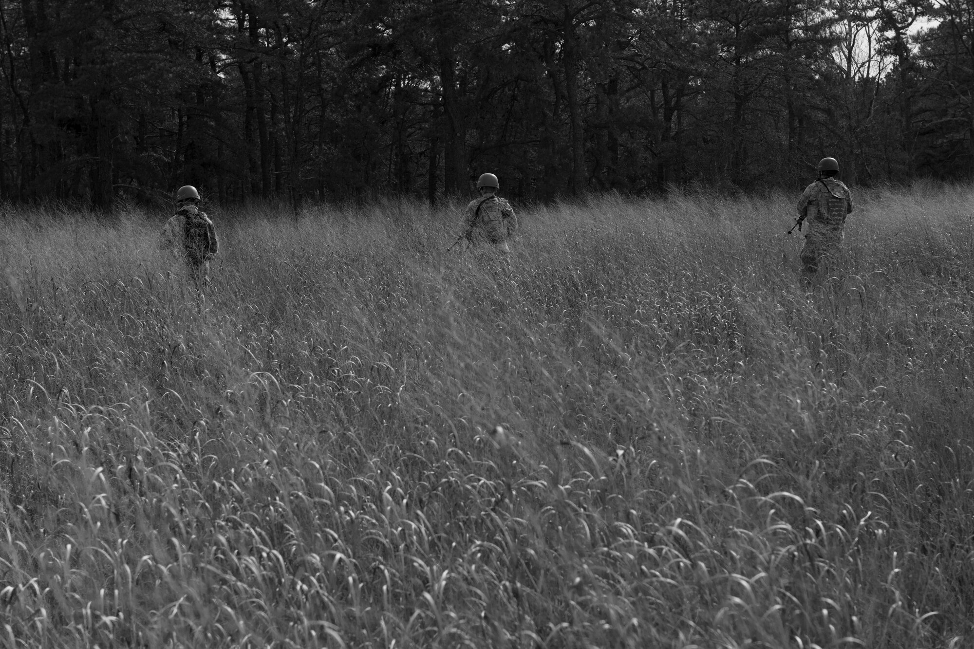 Field Craft Contingency Response students walk through a field during tactics training on Joint Base McGuire-Dix-Lakehurst, N.J. Feb. 2. The students used skills learned earlier in the day to move correctly as an individual and as a team.