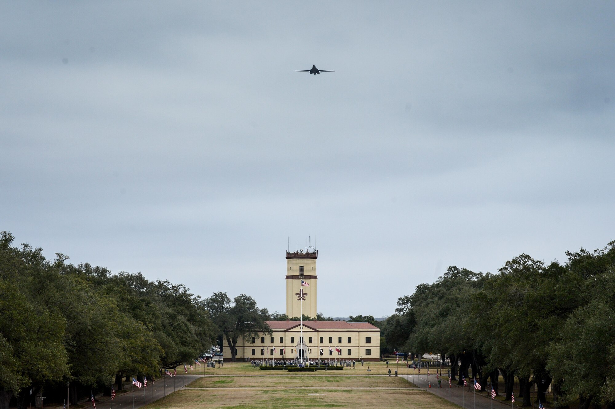 A B-1B Lancer soars over the 2nd Bomb Wing headquarters building at Barksdale Air Force Base, La., in commemoration of the 8th Air Force’s 75th anniversary Feb. 2, 2017. The modern day 8th Air Force traces its lineage to VIII Bomber Command, which came to life Feb. 1, 1942. Former and present bomber Airmen from across the country celebrated the anniversary by partaking in various event to honor the past, present and future Airmen of the “Mighty Eighth.” (U.S. Air Force photo by Senior Airman Mozer O. Da Cunha)