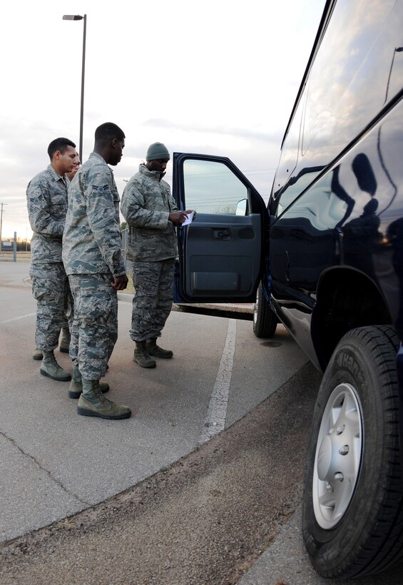 U.S. Air Force Staff Sgt. Dray Jackson, right,  7th Logistics Readiness Squadron vehicle operator, walks through a checklist with Airmen during training at Dyess Air Force Base, Texas, Dec. 14, 2016. Trainers ensure hands-on training, flightline training and computer based training are completed for all Airmen in their unit. (U.S. Air Force photo by Airman 1st Class April Lancto)