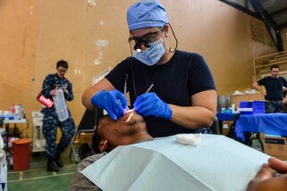PUERTO BARRIOS, Guatemala (Feb. 3, 2017) -- Chief Hospital Corpsman Meagen Fahey, a native of Wakefield, N.H., assigned to Naval Dental Center Camp Lejeune, N.C., performs a cleaning on a host nation patient at the Continuing Promise 2017 (CP-17) medical site in Puerto Barrios, Guatemala. CP-17 is a U.S. Southern Command-sponsored and U.S. Naval Forces Southern Command/U.S. 4th Fleet-conducted deployment to conduct civil-military operations including humanitarian assistance, training engagements, and medical, dental, and veterinary support in an effort to show U.S. support and commitment to Central and South America. (U.S. Navy Combat Camera photo by Petty Officer 2nd Class Brittney Cannady)