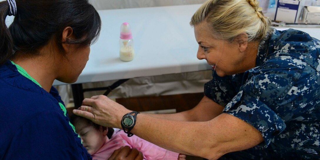170203-N-YM856-145 (Feb. 3, 2017) PUERTO BARRIOS, Guatemala - Cmdr. Ellen Argo, a native of Stadford, Va., and nurse practitioner assigned to Naval Health Clinic Quantico, Va., examines a host nation patient during a wellness check at the Continuing Promise 2017 (CP-17) medical site in Puerto Barrios, Guatemala. CP-17 is a U.S. Southern Command-sponsored and U.S. Naval Forces Southern Command/U.S. 4th Fleet-conducted deployment to conduct civil-military operations including humanitarian assistance, training engagements, and medical, dental, and veterinary support in an effort to show U.S. support and commitment to Central and South America. (U.S. Navy Combat Camera photo by Petty Officer 2nd Class Brittney Cannady)
