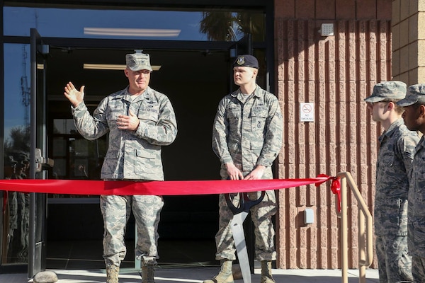 Col. Paul Murray, 99th Air Base Wing commander, Nellis Air Force Base speaks to future residents of Dormitory 781 Feb. 3. Murray cut the ribbon officially opening the 85,250-square-foot facility. The complex features an energy efficient heating, ventilation, and air conditioning system that allows for each room to have individual temperature control. 