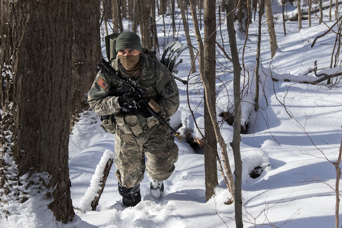 Army National Guard Pfc. Osman Mejia-Corrales patrols toward his next objective during winter training at Camp Ethan Allen Training Site in Jericho, Vt., Jan. 31, 2017. Mejia-Corrales is assigned to the Vermont Army National Guard’s Company A, 3rd Battalion, 172nd Infantry Regiment, 86th Infantry Brigade Combat Team (Mountain). Army National Guard photo by Spc. Avery Cunningham 
