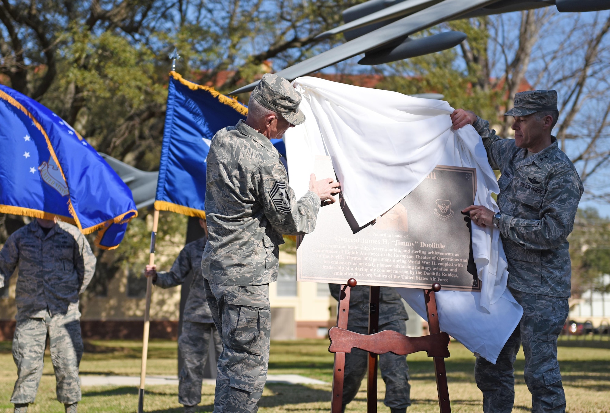 Chief Master Sgt. Alan Boling, 8th Air Force command chief, and Maj. Gen. Thomas Bussiere, 8th AF commander, unveil a plaque during a building dedication ceremony at Barksdale Air Force Base, La., Feb. 2, 2017. The 8th AF headquarters building was dedicated to General James H. “Jimmy” Doolittle during a series of 8th AF 75th diamond anniversary events. On Feb. 1, the Eighth celebrated its 75th anniversary, and former and current “Mighty Eighth” Airmen from across the country came to Barksdale AFB to take part in the celebration. (U.S. Air Force photo by Senior Airman Erin Trower)