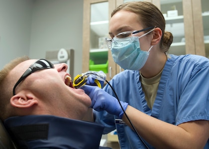 Senior Airman Emily Ferguson, 359th Medical Group dental technician, prepares Master Sgt. Jason Daniels for a dental x-ray at the Randolph Dental Clinic on Joint Base San Antonio-Randolph, Texas, Jan 10. The dental clinic provides full-service general dentistry to include restorative dentistry, preventive dentistry, endodontics, prosthodontics and limited oral surgery as well as periodontics, to active duty personnel. Daniels is a financial services section chief with the 340th Flying Training Group. (U.S. Air Force photo/Staff Sgt. Kevin Iinuma)
