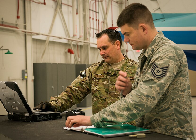 Airmen with the 919th Special Operations Maintenance Group verify procedures before working on a C-145 Skytruck Jan. 6 at Duke Field, Fla.  (U.S. Air Force photo/Tech. Sgt. Jasmin Taylor)