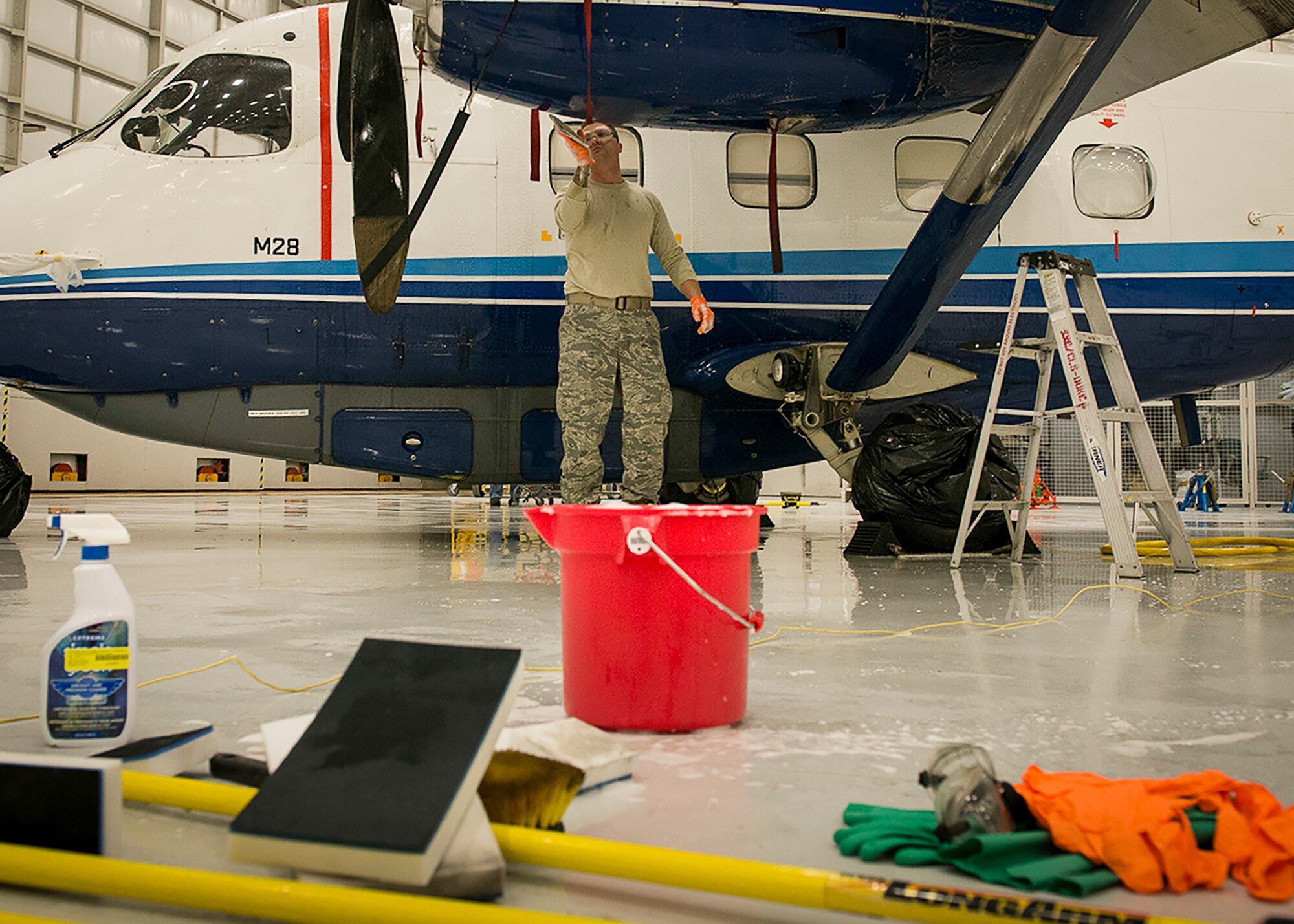 A 919th Special Operations Maintenance Group Airman washes a C-145 Skytruck at Duke Field, Fla.  (U.S. Air Force photo/Tech. Sgt. Jasmin Taylor)