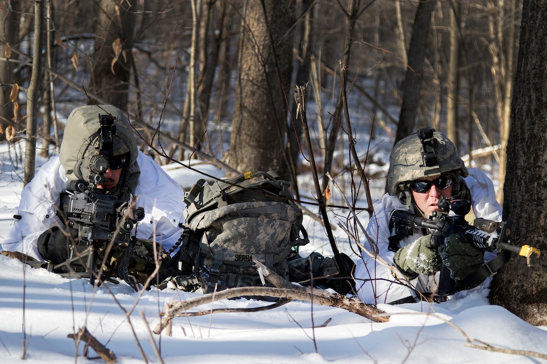 Army National Guardsmen provide rear area security en route to their objective during winter training at Camp Ethan Allen Training Site in Jericho, Vt., January 31, 2017. Army National Guard photo by Spc. Avery Cunningham