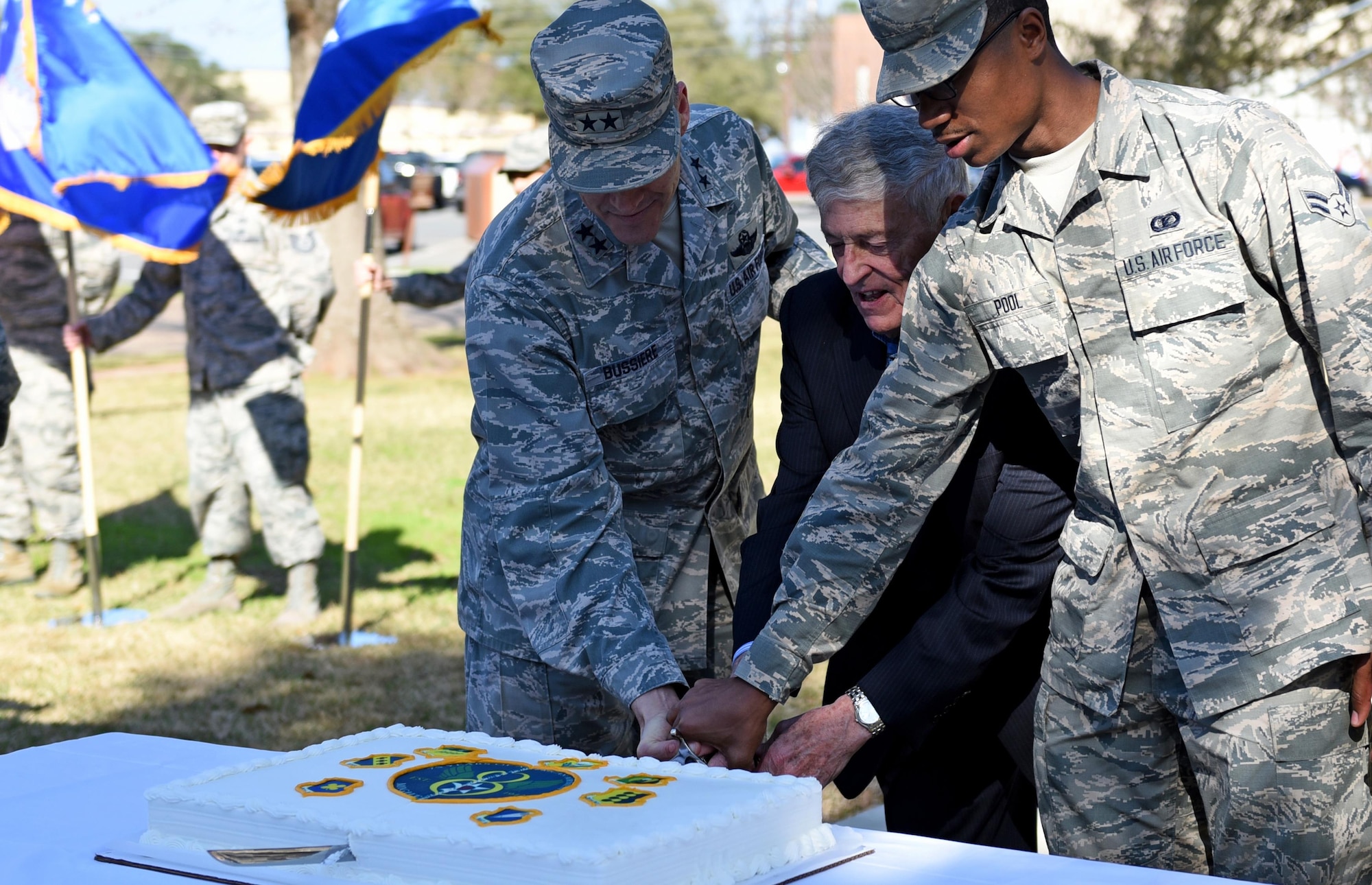 Maj. Gen. Thomas Bussiere, 8th Air Force commander, participates in a cake cutting ceremony with a former 8th AF commander, Gen. James McCarthy, (retired), and Airman 1st Class De’Andre Pool, 608th Air Operations Center administration apprentice, at Barksdale Air Force Base, La., Feb. 2, 2017. Various events, such as a memorial run, building dedication, cake cutting ceremony, and a local organization sponsored gala, took place to honor and commemorate the former, present and future Airmen of the “Mighty Eighth”. (U.S. Air Force photo by Senior Airman Erin Trower) 