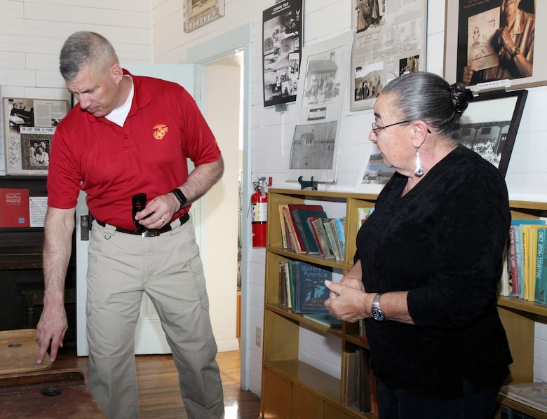 Brig. Gen. William F. Mullen III, Combat Center Commanding General, inspects a desk with Twentynine Palms Historical Society volunteer Pat Rimmington during a tour of the Old Schoolhouse Museum in Twentynine Palms, Calif., Jan. 31, 2017. Mullen and his wife, Vicki, toured the facility with Sgt. Maj. Michael J. Hendges, Combat Center Major; Cpl. Ben Mills, driver; Jim Ricker, Assistant Chief of Staff for Government and External Affairs; and Kristina Becker, Combat Center External Affairs Director. (Official Marine Corps photo by Kelly O'Sullivan/Released)