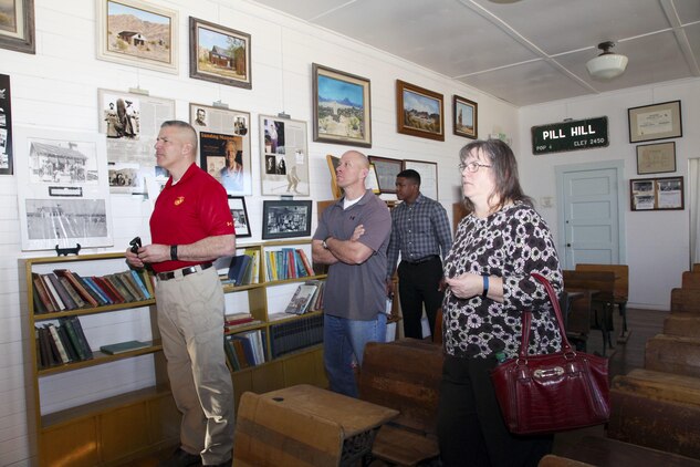 Brig. Gen. William F. Mullen III, Combat Center Commanding General, left; Sgt. Maj. Michael J. Hendges, Combat Center Sergeant Major; Cpl. Ben Mills, driver; and Vicki Mullen listen to Twentynine Palms Historical Society volunteer Pat Rimmington during a tour of the Old Schoolhouse Museum in Twentynine Palms, Calif., Jan. 31, 2017. The four toured the facility with Jim Ricker, Combat Center Assistant Chief of Staff for Government and External Affairs; and Kristina Becker, Combat Center External Affairs Director. (Official Marine Corps photo by Kelly O'Sullivan/Released)