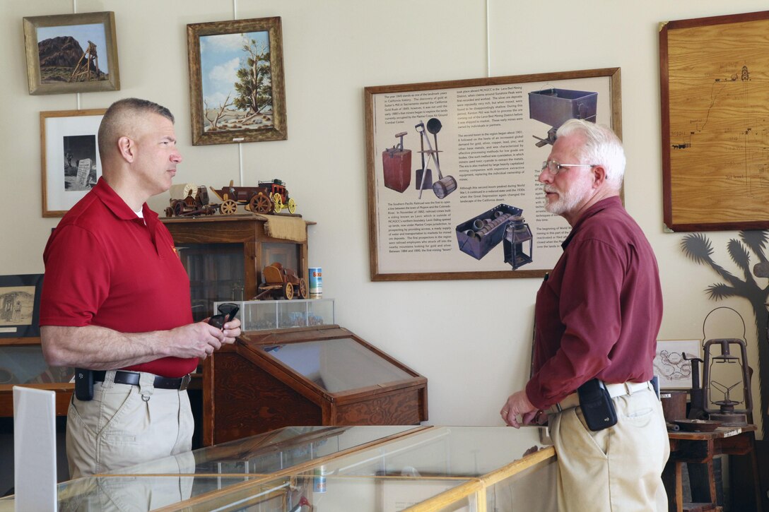 Brig. Gen. William F. Mullen III, Combat Center Commanding General, talks with Twentynine Palms Historical Society President Les Snodgrass during a tour of the Old Schoolhouse Museum in Twentynine Palms, Calif., Jan. 31, 2017. The general and his wife toured the facility with Sgt. Maj. Michael J. Hendges, Combat Center Sergeant Major; Cpl. Ben Mills, driver; Jim Ricker, Combat Center Assistant Chief of Staff for Government and External Affairs; and Kristina Becker, Combat Center External Affairs Director. (Official Marine Corps photo by Kelly O'Sullivan/Released)