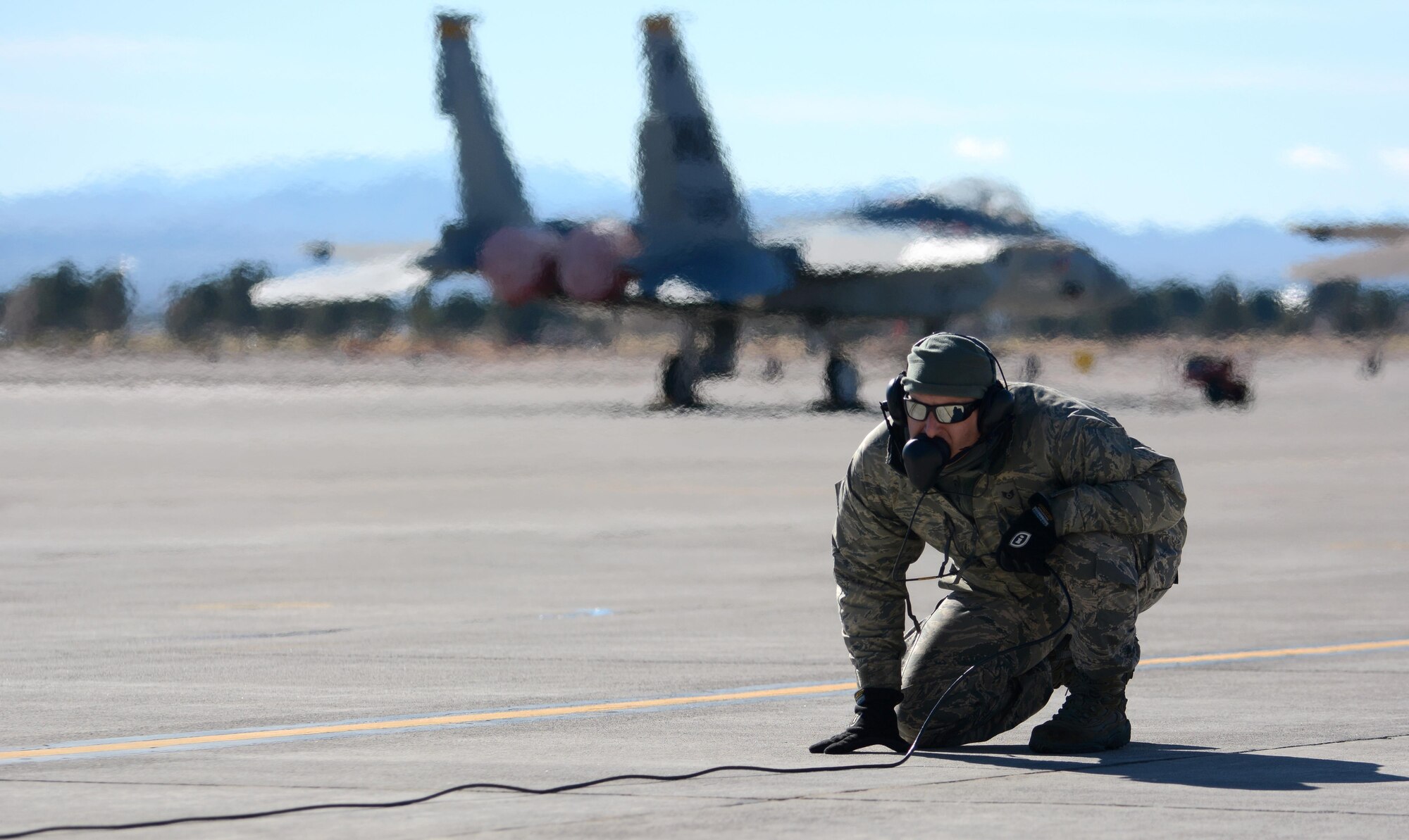 Staff Sgt. Joseph Pollock, crew chief, pre-flights an F-15 Eagle on Nellis Air Force Base, Nevada Jan. 21, 2017. Airmen from the 125th Fighter Wing deployed for 3 weeks to Nellis AFB for Red Flag 17-1, the first Red Flag training exercise to integrate the F-35a. (Air National Guard photo by Master Sgt. William J. Buchanan/Released)