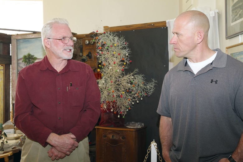 Sgt. Maj. Michael J. Hendges, Combat Center Sergeant Major, right, talks with Twentynine Palms Historical Society President Les Snodgrass about local history during a tour of the Old Schoolhouse Museum in Twentynine Palms, Calif., Jan. 31, 2017. The sergeant major toured the facility with Brig. Gen. William F. Mullen III, Combat Center Commanding General and his wife, Vicki; Cpl. Ben Mills, driver; Jim Ricker, Combat Center Assistant Chief of Staff for Government and External Affairs; and Kristina Becker, External Affairs Director. (Official Marine Corps photo by Kelly O'Sullivan/Released)