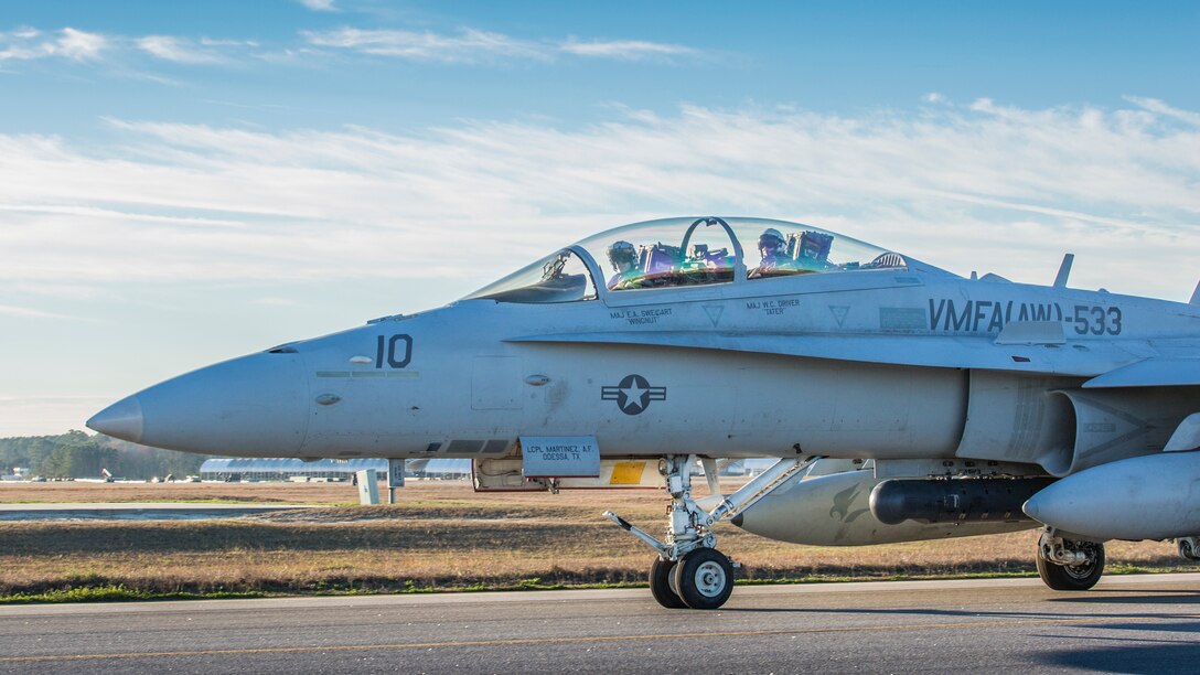 An F-18D Hornet taxis down the flight line for a training exercise during the Marine Division Tactics Course aboard Marine Corps Air Station Beaufort, Jan. 27, 2017. One pilot and one Weapons System Operator were selected from each squadron to participate in MDTC to hone their skills in air to air tactics. The Marines are with Marine All-Weather Fighter Attack Squadron 224, Marine Aircraft Group 31.