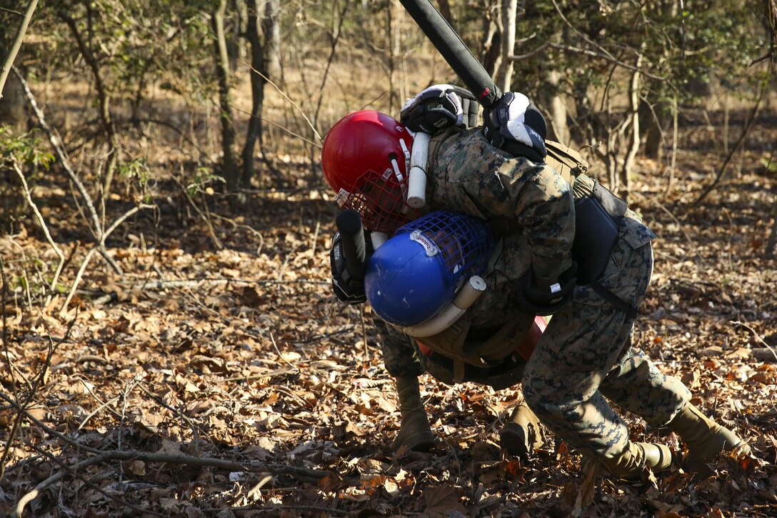 Marines grapple during a training exercise as a part their Marine Corps Martial Arts Instructor Course at Marine Corps Base Quantico, Va., Dec. 15, 2016. The exercise consisted of hiking, weapons sparring, an obstacle course, and insertion by MV-22 Osprey.