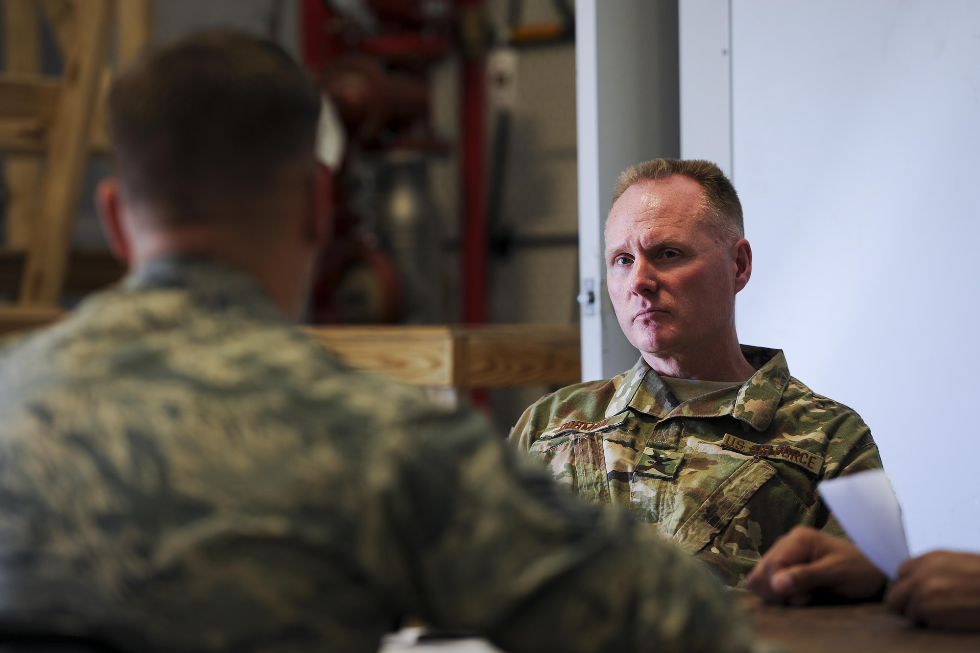 Col. Gary Dorman, the commander of the 1st Special Operations Mission Support Group, listens to a commander in-brief during the Joint Contingency Contracting Officer Exercise at Hurlburt Field, Fla., Jan. 31, 2017. The exercise is used to replicate a deployed environment to enhance readiness and prepare Air Commandos for future operations. (U.S. Air Force photo by Airman Dennis Spain)