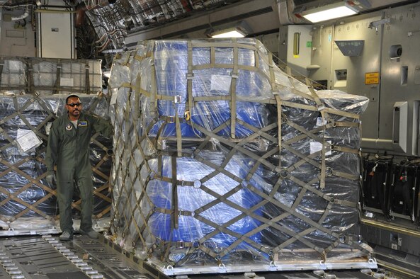 Master Sgt. Ulysius Vance, Raven team member from the 315th Security Forces Squadron, assists in order to expedite the offloading of palletized humanitarian aid from a U.S. Air Force C-17 Globemaster III cargo aircraft in Managua, Nicaragua, Feb. 5, 2017.  Over 130,000 pounds of cargo, most of which was food, was delivered on two separate flights.  (U.S. Air Force photo by 1st Lt. Justin Clark)
