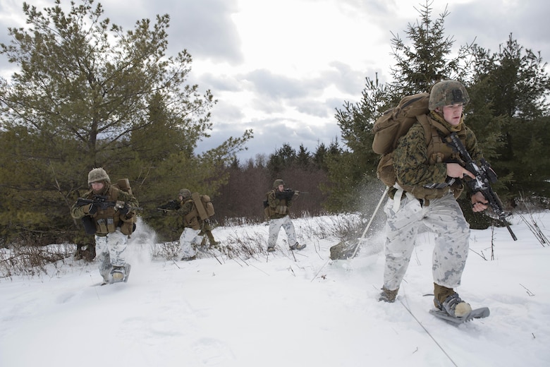 Marines with Company C, 1st Battalion, 25th Marine Regiment, 4th Marine Division, use snow shoes to patrol the rough terrain of Burwash, Ontario, during exercise Riley Xanten II, Feb. 3-5, 2017. During the exercise, the Marines joined soldiers from the Canadian Armed Forces to exchange knowledge and increase proficiency in cold weather tactics, survival skills, shelter building, ice fishing, and more. (U.S. Marine Corps photo by Sgt. Sara Graham/released)
