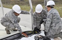 Airmen from the 919 Special Operations Force Support Squadron begin building a tent structure during the unit training assembly Feb. 5 at Duke Field, Fla.  The Airmen built the tent then served a meal out of it to meet an annual training requirement.  (U.S. Air Force photo/Dan Neely) 