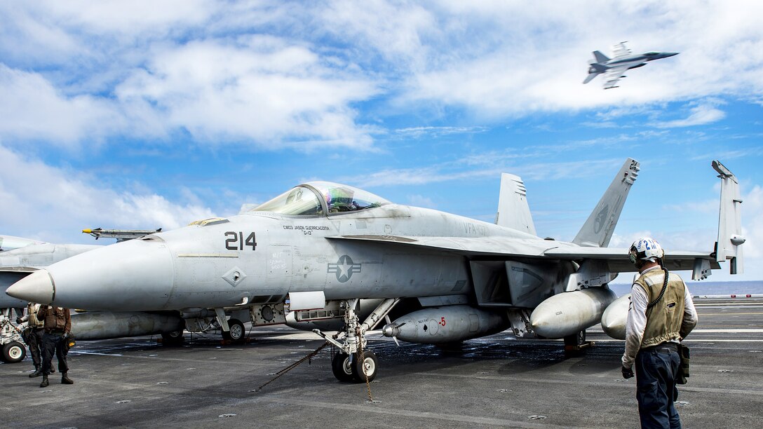 Navy Capt. Doug Verissimo, commanding officer of the aircraft carrier USS Carl Vinson, conducts preflight checks in an F/A 18E Super Hornet aircraft on the flight deck of the USS Carl Vinson in the Pacific Ocean, Jan. 30, 2017. Navy photo by Petty Officer 3rd Class Matt Brown 
