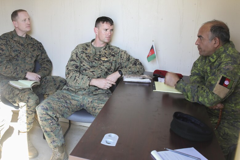 Marines with Task Force Southwest speak with an Afghan role player during a rapport-building exercise at Camp Lejeune, N.C., Feb. 2, 2016. The training is designed to prepare a team of approximately 30 Marines to understand cultural norms and nuances prior to a deployment to Helmand Province, Afghanistan. Approximately 300 Marines with Task Force Southwest will work to train, advise and assist the Afghan National Army 215th Corps and 505th Zone National Police. (U.S. Marine Corps photo by Sgt. Lucas Hopkins)