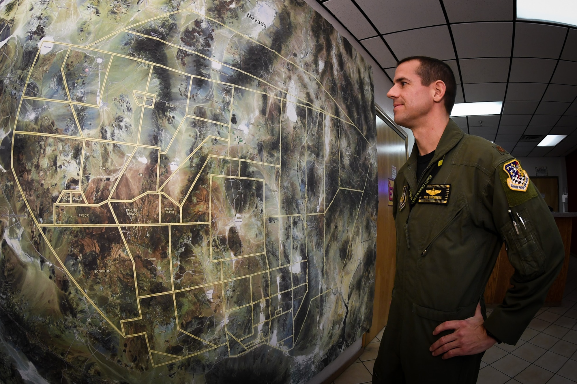 Maj. Shad Stromberg, F-35A pilot in the 419th Fighter Wing, surveys a map of the Nevada Test and Training Range during the Red Flag exercise at Nellis Air Force Base, Nev., Feb. 3. (U.S. Air Force photo/R. Nial Bradshaw)