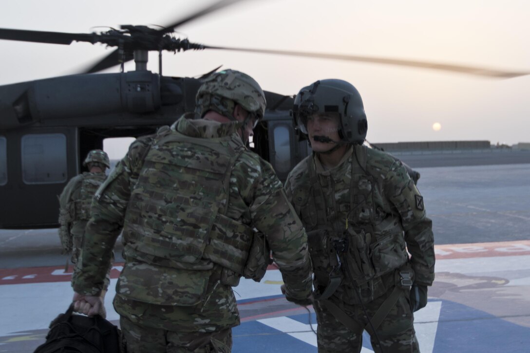 Brig. Gen. Robert D. Harter, deputy commanding general of the 1st Sustainment Command (Theater) / commanding general of the 316th Sustainment Command (Expeditionary), prepares to board a UH-60 Black Hawk at Camp Arifjan, Kuwait, on February 2, 2017. 