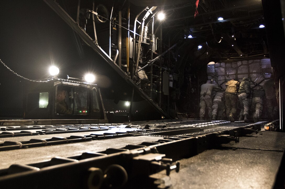 U.S. Air Force Airmen load a C-130 Hercules at Ali Al Salem, Kuwait, on February 2, 2017. 