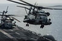 170203-N-LI768-422 GULF OF ADEN (Feb. 3, 2017) A CH-53E Super Stallion helicopter assigned to the Ridge Runners of Marine Medium Tiltrotor Squadron (VMM) 163 takes off from the amphibious assault ship USS Makin Island (LHD 8). The ship is deployed with the Makin Island Amphibious Ready Group to the U.S. 5th Fleet area of operations in support of maritime security operations and theater security cooperation efforts. (U.S. Navy photo by Mass Communication Specialist 3rd Class Devin M. Langer/Released) 