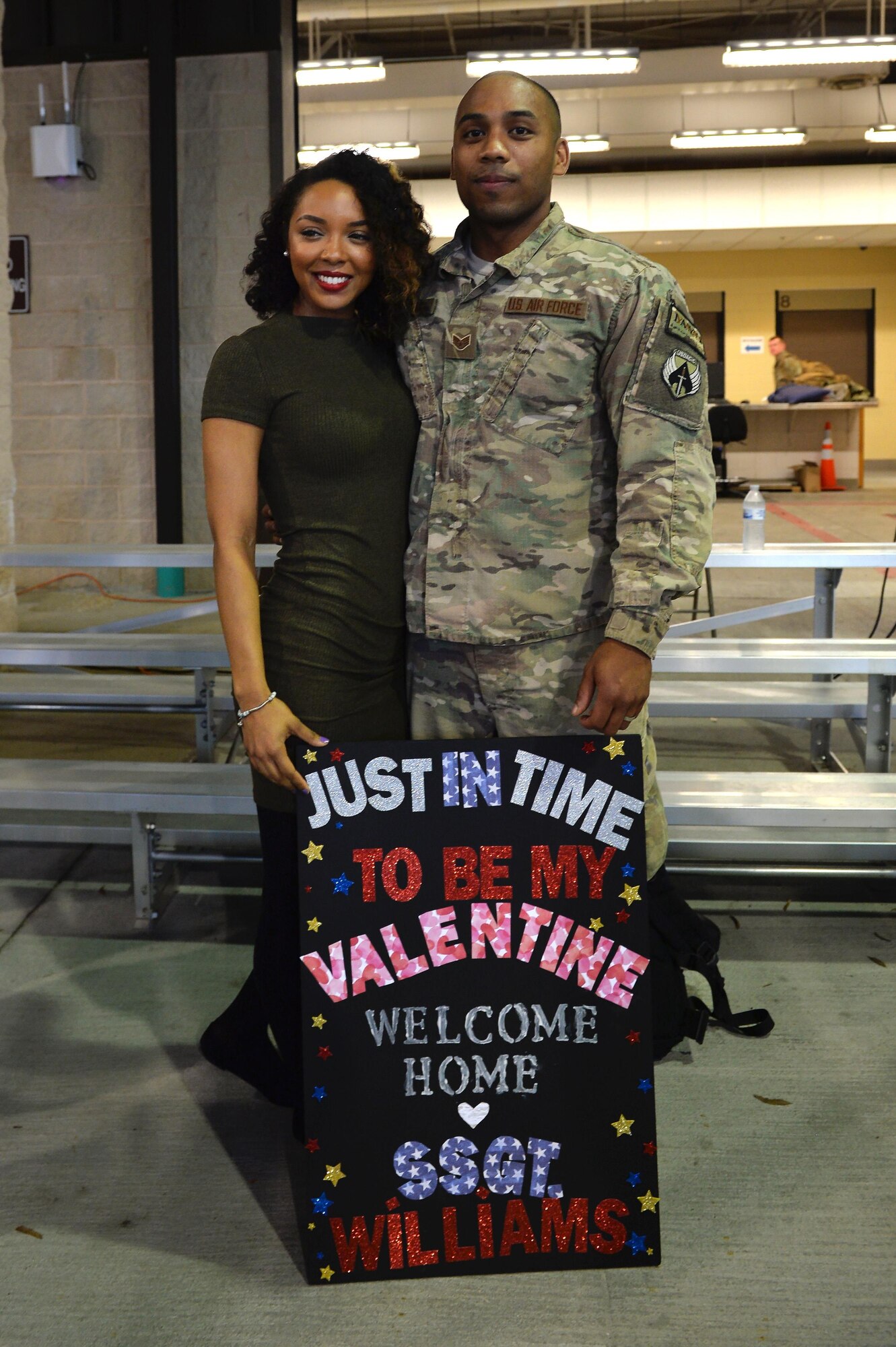 Staff Sgt. Christopher Williams, a munitions specialist with the 1st Special Operations Maintenance Squadron, stands with his wife, Danielle, during an Operation Homecoming at Hurlburt Field, Fla., Feb. 7, 2017. During Operation Homecoming, families are able to welcome home Air Commandos as they return from deployed locations. (U.S. Air Force photo by Senior Airman Andrea Posey)