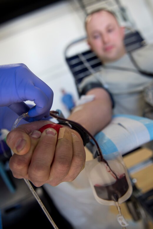 Senior Master Sgt. Frank Worsham, Air National Guard Readiness Center avionics functional area manager, squeezes a ball while giving blood during the Armed Services Blood Bank Center’s blood donation at the West Fitness Center on Joint Base Andrews, Md., Feb. 6, 2017. Blood received by the ASBBC is shipped to military treatment facilities across the globe and used overseas at forward deployed locations. (U.S. Air Force photo by Senior Airman Philip Bryant)