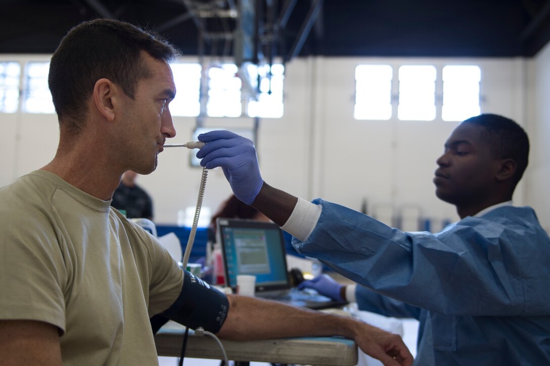 Col. Troy Roberts, 11th Security Forces commander, has his temperature measured as a pre-evaluation prior to giving blood during the Armed Services Blood Bank Center’s blood donation on Joint Base Andrews, Md., Feb. 6, 2017. The ASBBC can only set up donation locations on federal installations making military members, military families and government employees the majority of donors. (U.S. Air Force photo by Senior Airman Philip Bryant)