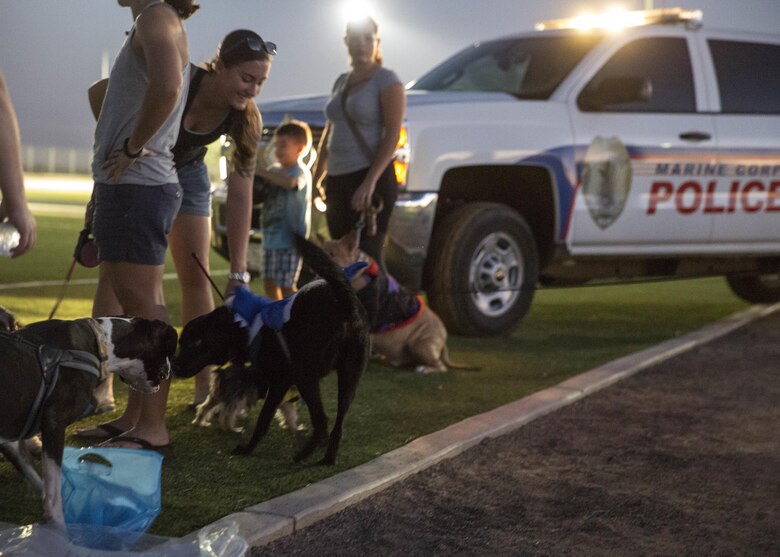 Service members, their families and pets enjoyed prizes and treats during the “Purple Paws for a Cause” event hosted by the Marine Corps Community Services Family Advocacy Program at Marine Corps Air Station Yuma, Ariz., Friday, October 21, 2016.